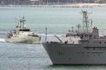 ID 4878 HMNZS RESOLUTION (A-14, 1989/1913grt/decommissioned 2012. Renamed GEO RESOLUTION) manoeuvres to her berth at Devonport Naval Base, Auckland, NZ as the Armidale-class patrol boat HMAS MARYBOROUGH...